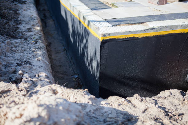 Professional Emergency Waterproofing technician working in Morley, MI